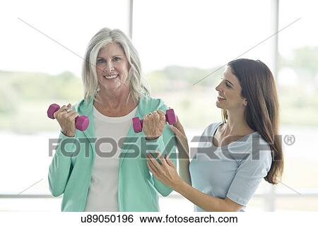 Senior woman with personal trainer View Large Photo Image Stock Photograph - Senior woman with personal trainer. Fotosearch