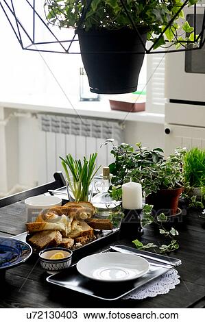 Set kitchen table with bread slices, fresh herbs and spring onions View Large Photo Image Stock Image - Set kitchen table with bread slices, fresh herbs and spring onions. Fotosearch