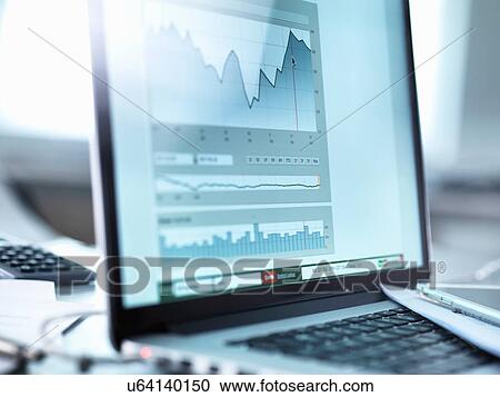 Stock Image - Share price data from investor's portfolio on a laptop computer screen. Fotosearch