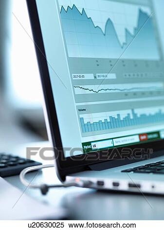 Stock Photography - Share price data from investor's portfolio on a laptop computer screen. Fotosearch