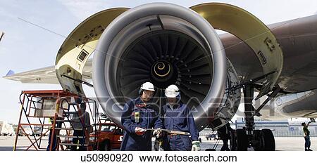 Stock Image - Stationary commercial aeroplane on ground. Fotosearch