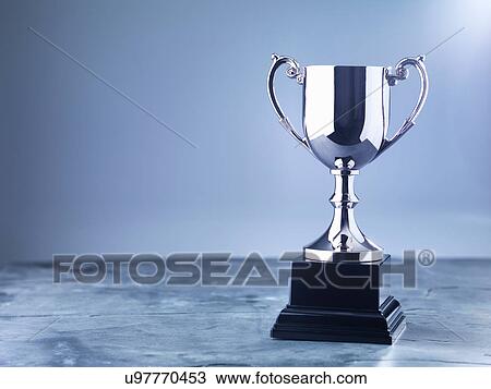 Stock Image - Still life of trophy awaiting the winner's presentation. Fotosearch
