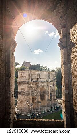 Stock Image - Sunlit view from Colosseum of the Arch of Constantine, Rome, Italy. Fotosearch