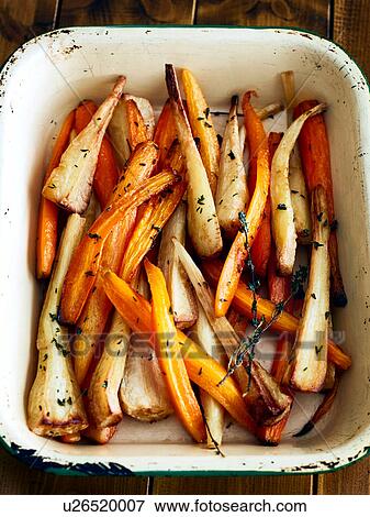 Tray of roasted carrots and parsnips View Large Photo Image Stock Photo - Tray of roasted carrots and parsnips. Fotosearch