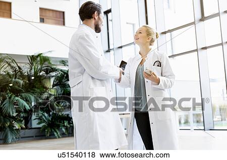 Stock Photo - Two doctors having discussion. Fotosearch
