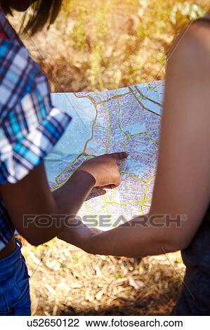 Two female friends, looking at map, rear view, Cape Town, South Africa View Large Photo Image Stock Image - Two female friends, looking at map, rear view, Cape Town, South Africa. Fotosearch