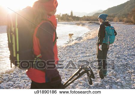 Two female hikers on lakeside in Bavarian Alps View Large Photo Image Stock Photograph - Two female hikers on lakeside in Bavarian Alps. Fotosearch