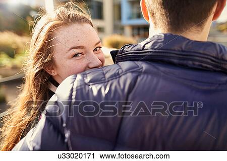 Two friends walking outdoors, young woman looking over shoulder, rear view, Bristol, UK View Large Photo Image Stock Image - Two friends walking outdoors, young woman looking over shoulder, rear view, Bristol, UK. Fotosearch