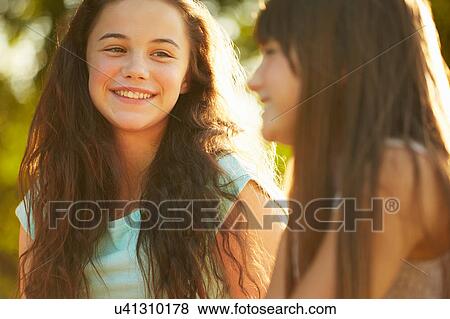 Two young girls in park View Large Photo Image Stock Photo - Two young girls in park. Fotosearch