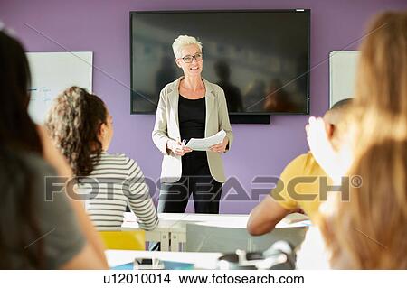 Picture - University lecturer and students in class. Fotosearch