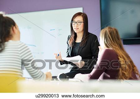 University lecturer and students in class View Large Photo Image Stock Image - University lecturer and students in class. Fotosearch