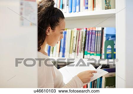 University student working in library View Large Photo Image Stock Image - University student working in library. Fotosearch