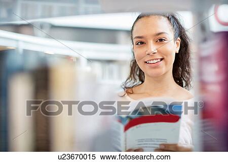 University student working in library View Large Photo Image Stock Photography - University student working in library. Fotosearch