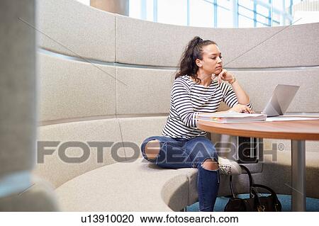 University student working in modern seating area View Large Photo Image Stock Image - University student working in modern seating area. Fotosearch