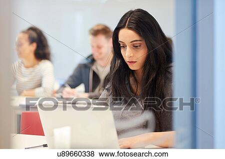 Stock Photo - University students in class. Fotosearch
