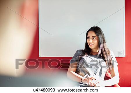 Stock Image - University students relaxing. Fotosearch
