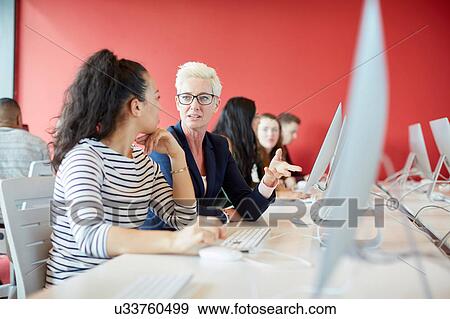 Stock Photo - University students working at computer in class. Fotosearch