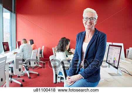Stock Photo - University students working at computer in class. Fotosearch