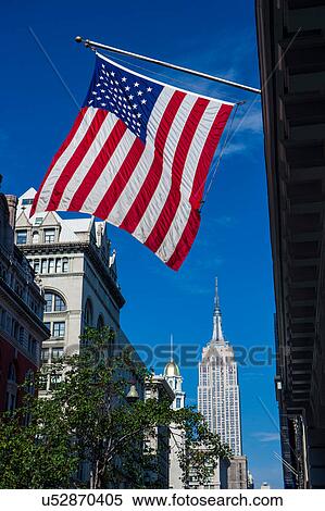 View of American flag and the Empire State Building from fifth avenue, New York, USA View Large Photo Image Stock Photography - View of American flag and the Empire State Building from fifth avenue, New York, USA. Fotosearch