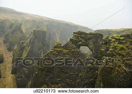 View of arch rock formation and canyons at Fjadrargljufur, Iceland View Large Photo Image Stock Image - View of arch rock formation and canyons at Fjadrargljufur, Iceland. Fotosearch