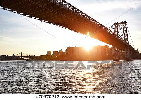 Stock Photo - View of East river and Williamsburg Bridge, New York City, USA. Fotosearch
