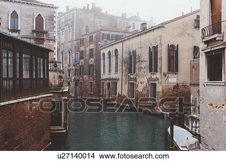 Picture - View of misty canal and old buildings, Venice, Italy. Fotosearch