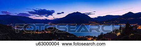 View of mountains across Lake Como, Varenna, Italy View Large Photo Image Picture - View of mountains across Lake Como, Varenna, Italy. Fotosearch
