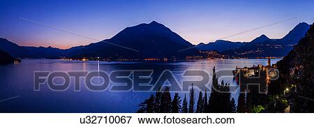 View of mountains across Lake Como, Varenna, Italy View Large Photo Image Stock Photo - View of mountains across Lake Como, Varenna, Italy. Fotosearch