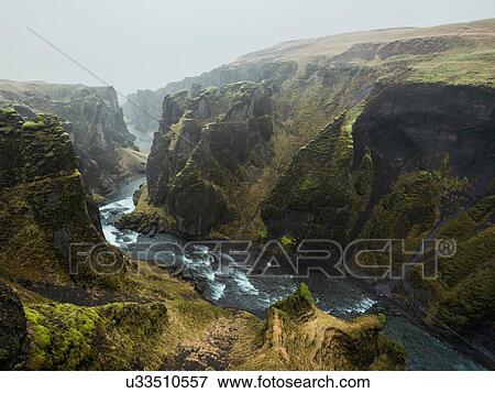 Stock Photo - View of river and canyon at Fjadrargljufur, Iceland. Fotosearch