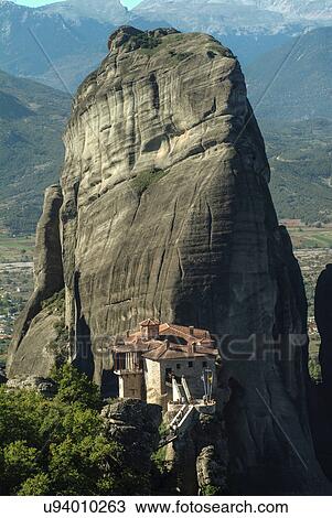 Stock Image - View of Roussanou Monastery perched on rock formation, Meteora, Thassaly, Greece. Fotosearch
