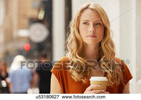 Woman having coffee in street, London, UK View Large Photo Image Stock Photo - Woman having coffee in street, London, UK. Fotosearch