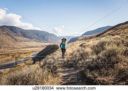 Woman hiking, Trans Canada Highway, near Kamloops, Boston Flats, British Columbia, Canada View Large Photo Image Picture - Woman hiking, Trans Canada Highway, near Kamloops, Boston Flats, British Columbia, Canada. Fotosearch