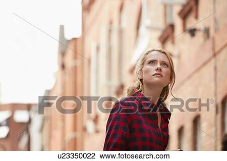 Stock Image - Woman in street, London, UK. Fotosearch