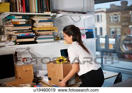 Stock Photo - Woman moving office. Fotosearch