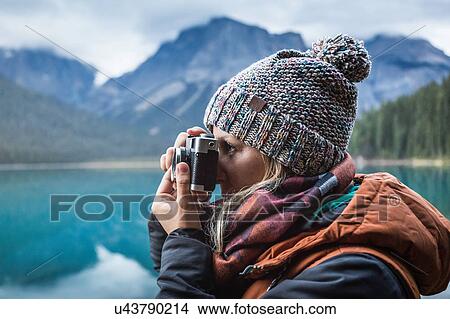 Woman taking photograph of view, Emerald Lake, Yoho National Park, Field, British Columbia, Canada View Large Photo Image Picture - Woman taking photograph of view, Emerald Lake, Yoho National Park, Field, British Columbia, Canada. Fotosearch