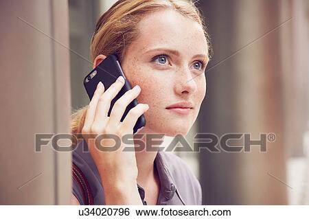 Woman using mobile phone View Large Photo Image Stock Photograph - Woman using mobile phone. Fotosearch
