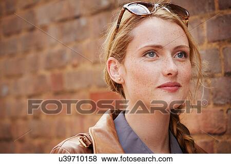 Woman walking along brick wall, London, UK View Large Photo Image Stock Photo - Woman walking along brick wall, London, UK. Fotosearch