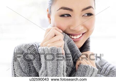 Woman wearing grey knitted sweater View Large Photo Image Stock Image - Woman wearing grey knitted sweater. Fotosearch