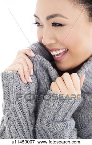Woman wearing grey knitted sweater View Large Photo Image Stock Photo - Woman wearing grey knitted sweater. Fotosearch
