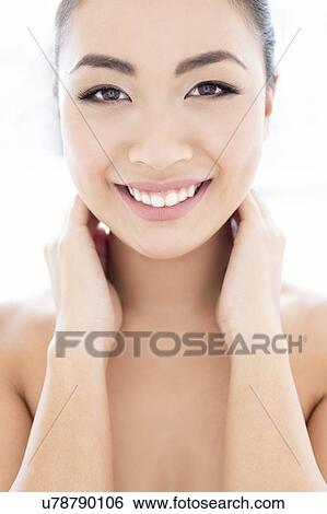 Woman with hands touching neck View Large Photo Image Stock Photograph - Woman with hands touching neck. Fotosearch