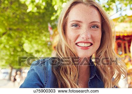 Women smiling, carousel in background, London, UK View Large Photo Image Stock Image - Women smiling, carousel in background, London, UK. Fotosearch