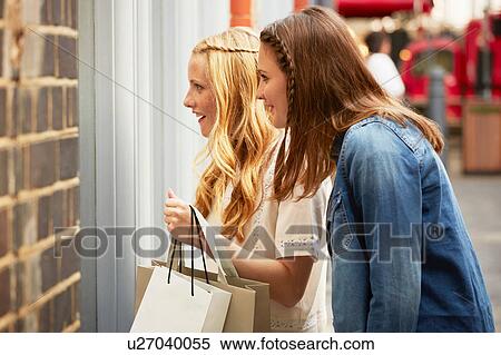 Stock Photography - Women window shopping, London, UK. Fotosearch