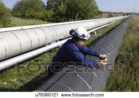 Worker checking gas pipeline View Large Photo Image Stock Image - Worker checking gas pipeline. Fotosearch