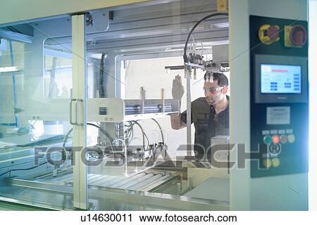 Worker operating circuit board processing machine in electronics factory View Large Photo Image Stock Image - Worker operating circuit board processing machine in electronics factory. Fotosearch