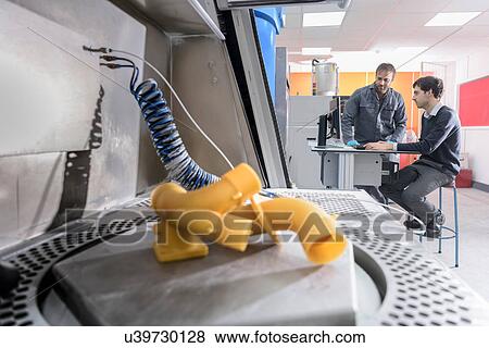 Workers 3D printing components in precision casting factory View Large Photo Image Stock Photo - Workers 3D printing components in precision casting factory. Fotosearch