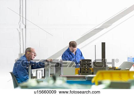 Workers finishing components in precision casting factory View Large Photo Image Stock Photo - Workers finishing components in precision casting factory. Fotosearch