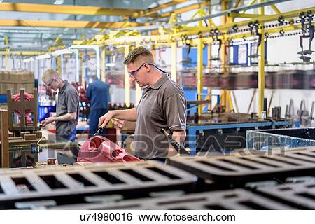 Workers making wax components in precision casting factory View Large Photo Image Stock Photograph - Workers making wax components in precision casting factory. Fotosearch