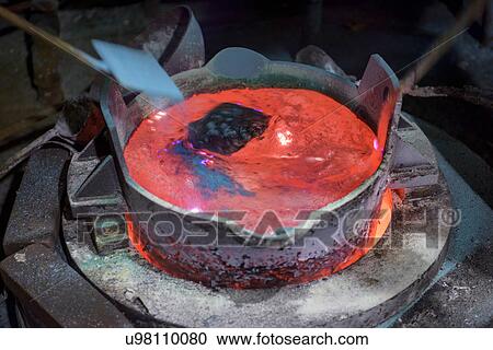 Workers stirring molten aluminium alloy in precision casting factory View Large Photo Image Stock Image - Workers stirring molten aluminium alloy in precision casting factory. Fotosearch