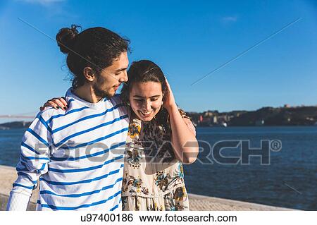 Young couple walking by sea, Lisbon, Portugal, Lisbon, Portugal View Large Photo Image Stock Photograph - Young couple walking by sea, Lisbon, Portugal, Lisbon, Portugal. Fotosearch