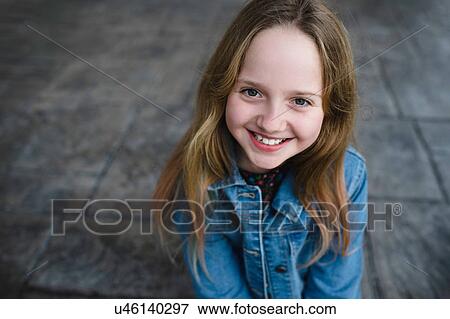 Stock Photo - Young girl smiling. Fotosearch